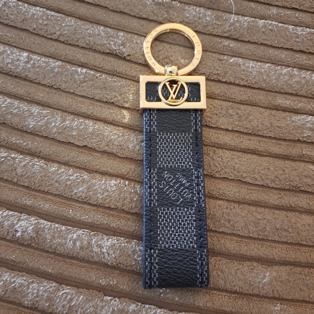 Louis Vuitton Keychain with Gold and Black Checkered Design